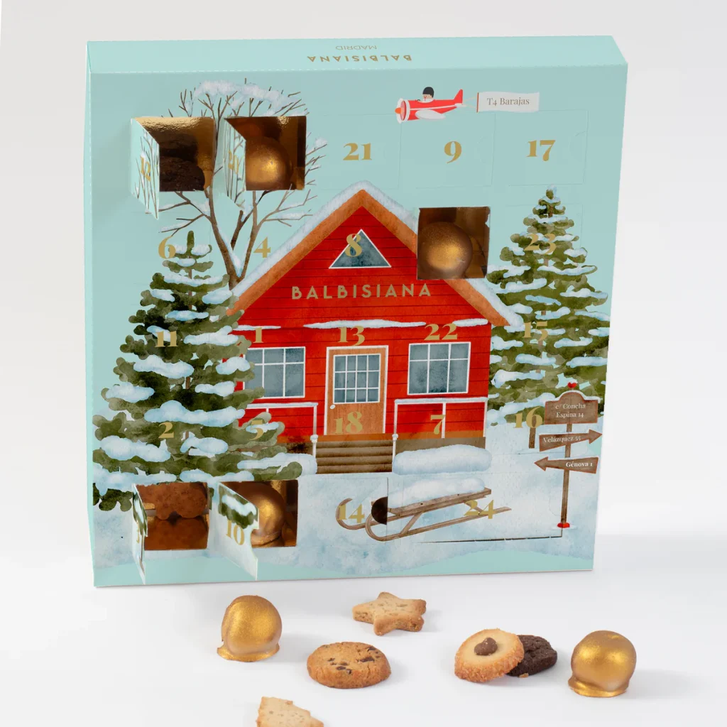 Calendario de Adviento de Balbisiana con 24 casillas de dulces variados, incluyendo trufitas de oreo, galletitas de jengibre y chocolatinas.